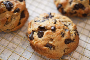 Levain-style vegan chocolate chunk walnut cookie with a thick gooey centre