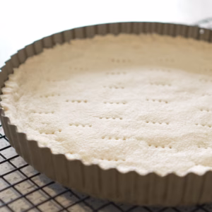 3-ingredient vegan tart crust pressed into a tart tin