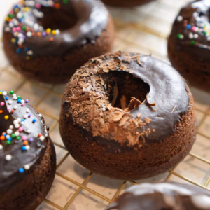 Baked vegan chocolate donuts with dairy-free ganache glaze