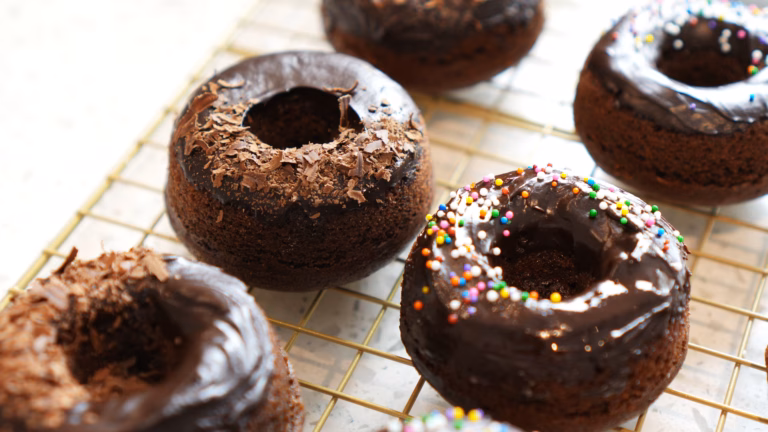 Baked vegan chocolate donuts with dairy-free ganache glaze